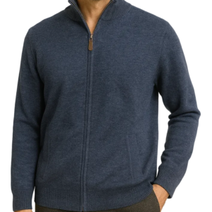 Man wearing a blue zip-up sweater against a beige background