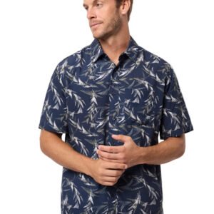 Man wearing a navy patterned shirt on a light gray background