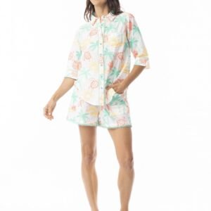 Woman wearing a floral pajama set on a white background